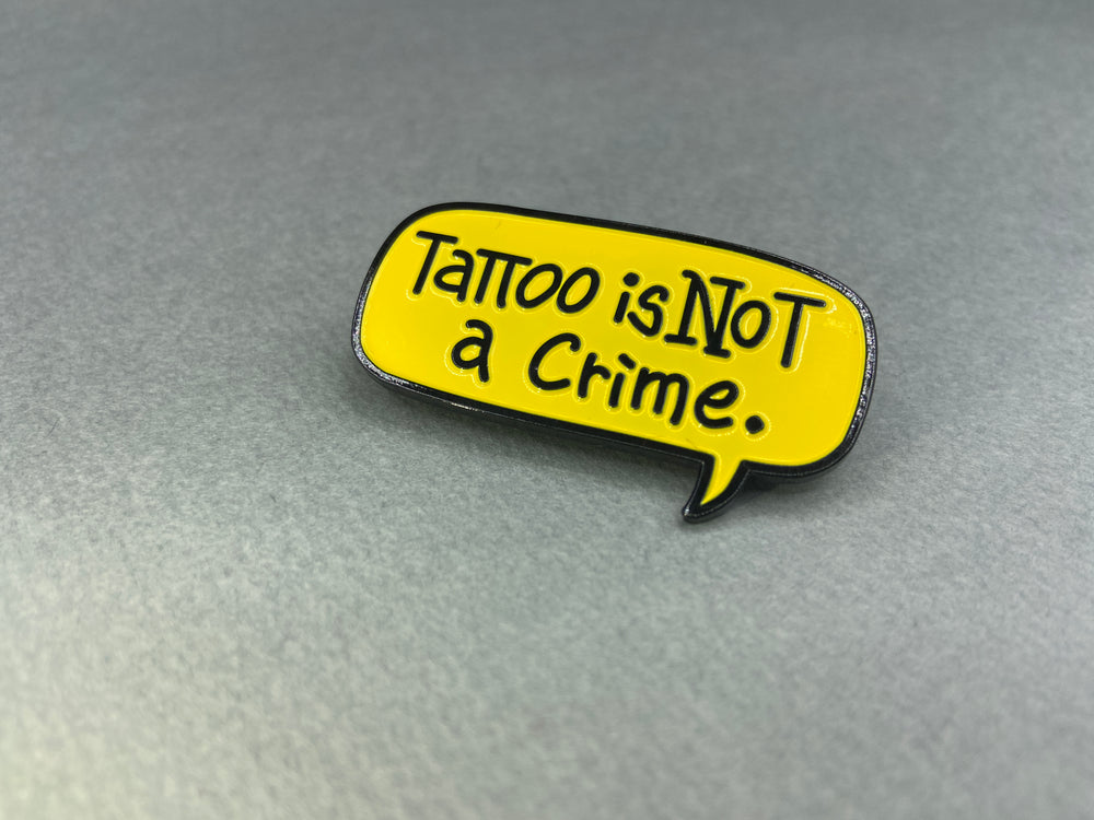 
                  
                    “Tattoo is not a crime” Pin badge
                  
                